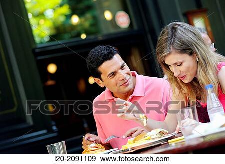 Couple eating in a restaurant. San Sebastian. Donostia. Gipuzkoa. Basque Country. Spain. View Large Photo Image Stock Photo - Couple eating in a restaurant. San Sebastian. Donostia. Gipuzkoa. Basque Country. Spain.. Fotosearch