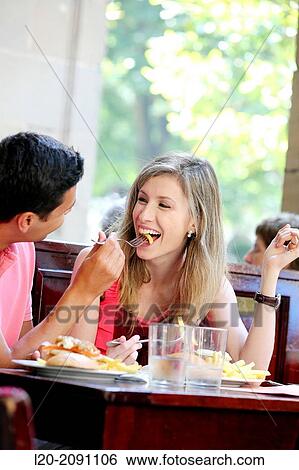 Couple eating in a restaurant. San Sebastian. Donostia. Gipuzkoa. Basque Country. Spain. View Large Photo Image Stock Photograph - Couple eating in a restaurant. San Sebastian. Donostia. Gipuzkoa. Basque Country. Spain.. Fotosearch