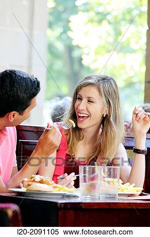 Stock Photography - Couple eating in a restaurant. San Sebastian. Donostia. Gipuzkoa. Basque Country. Spain.. Fotosearch