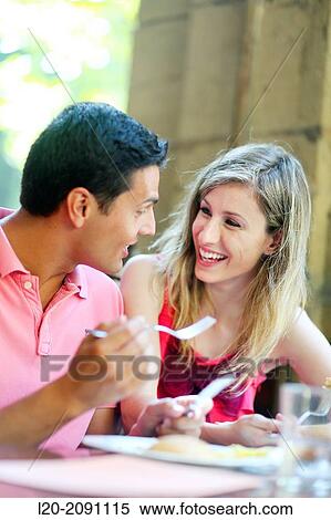Couple eating in a restaurant. San Sebastian. Donostia. Gipuzkoa. Basque Country. Spain. View Large Photo Image Stock Photography - Couple eating in a restaurant. San Sebastian. Donostia. Gipuzkoa. Basque Country. Spain.. Fotosearch