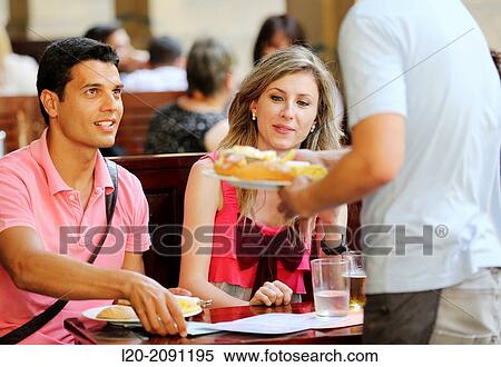 Couple eating in a restaurant. San Sebastian. Donostia. Gipuzkoa. Basque Country. Spain. View Large Photo Image Stock Photography - Couple eating in a restaurant. San Sebastian. Donostia. Gipuzkoa. Basque Country. Spain.. Fotosearch