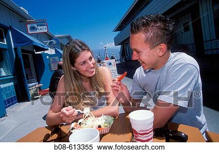Couple eating Salad at Harbour area. Santa Barbara, California, USA. View Large Photo Image Stock Photography - Couple eating Salad at Harbour area. Santa Barbara, California, USA.. Fotosearch