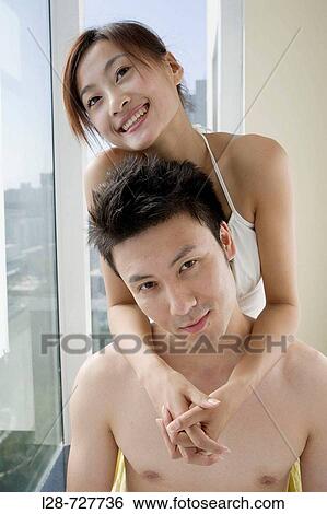 Couple embraced, smiling, close-up View Large Photo Image Stock Photograph - Couple embraced, smiling, close-up. Fotosearch