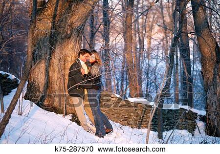 couple embracing in the snow View Large Photo Image Stock Image - couple embracing in the snow. Fotosearch