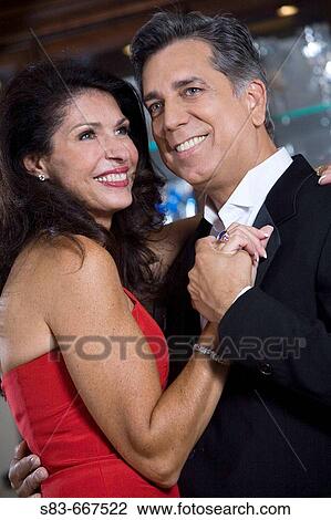 Couple embracing indoors View Large Photo Image Stock Image - Couple embracing indoors. Fotosearch