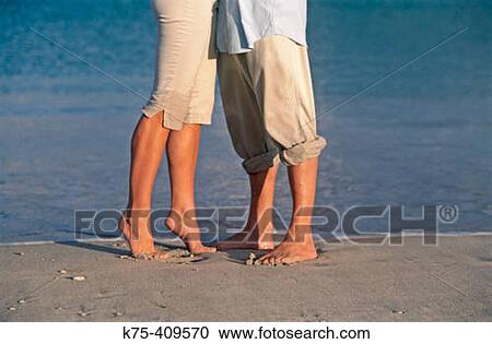 couple embracing on beach View Large Photo Image Stock Image - couple embracing on beach. Fotosearch