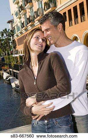 Stock Image - Couple embracing on bridge in Ft. Lauderdale FL. Fotosearch