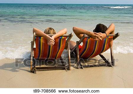 Couple enjoying the sea view View Large Photo Image Stock Photograph - Couple enjoying the sea view. Fotosearch