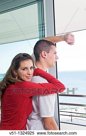 Couple enjoying the views from home View Large Photo Image Stock Photography - Couple enjoying the views from home. Fotosearch