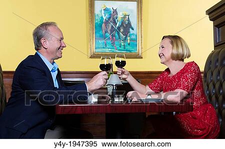 Couple enjoying wine at the Polo Grill in Vero Beach, Florida, USA. View Large Photo Image Stock Photography - Couple enjoying wine at the Polo Grill in Vero Beach, Florida, USA.. Fotosearch