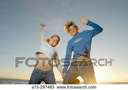 Couple feeling good at the Beach View Large Photo Image Stock Image - Couple feeling good at the Beach. Fotosearch