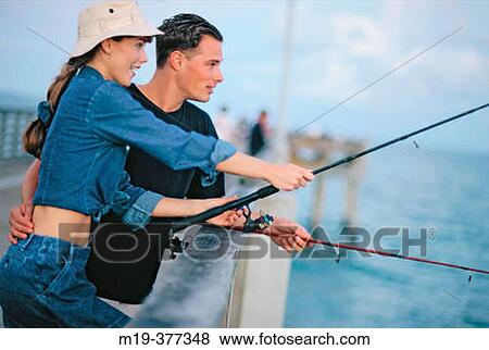 couple fishing from a pier View Large Photo Image Stock Photo - couple fishing from a pier. Fotosearch
