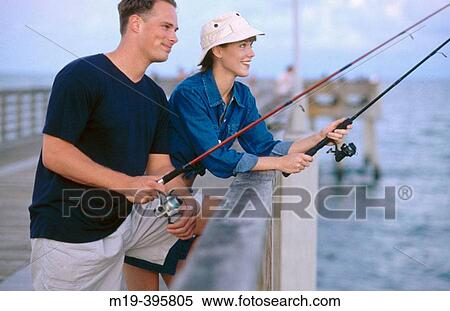 couple fishing on a pier View Large Photo Image Stock Photography - couple fishing on a pier. Fotosearch