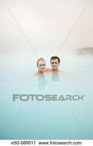 Stock Image - Couple from Norway at Blue Lagoon, Geothermal Hot Springs near Reykjavik, Iceland. Fotosearch