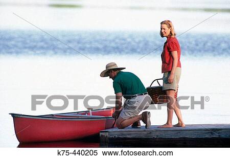 couple getting canoe ready View Large Photo Image Stock Photography - couple getting canoe ready. Fotosearch