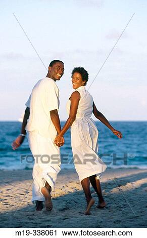 couple hand in hand at the beach View Large Photo Image Stock Image - couple hand in hand at the beach. Fotosearch