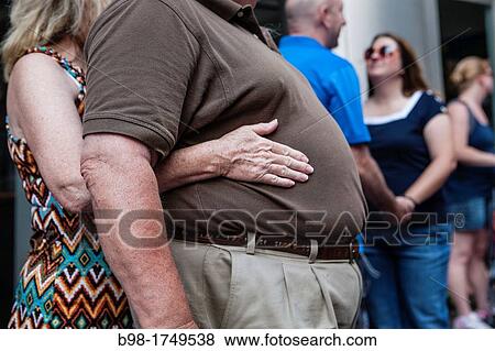 couple, hand, stomach, fat, obese, wellness, unhealthy View Large Photo Image Stock Photo - couple, hand, stomach, fat, obese, wellness, unhealthy. Fotosearch