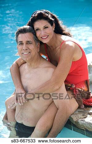 Couple hanging out in pool View Large Photo Image Stock Image - Couple hanging out in pool. Fotosearch