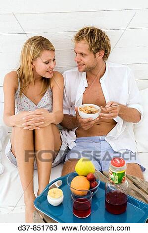 Couple having breakfast at home View Large Photo Image Stock Image - Couple having breakfast at home. Fotosearch