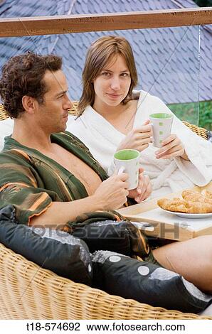 couple having breakfast on sofa View Large Photo Image Stock Image - couple having breakfast on sofa. Fotosearch