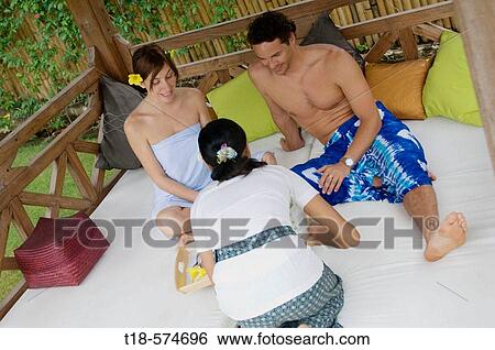 couple having breakfast served by waitress View Large Photo Image Stock Photograph - couple having breakfast served by waitress. Fotosearch