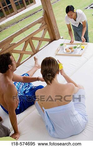 couple having breakfast served by waitress View Large Photo Image Stock Photography - couple having breakfast served by waitress. Fotosearch
