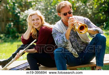 couple having fun, playing music View Large Photo Image Picture - couple having fun, playing music. Fotosearch