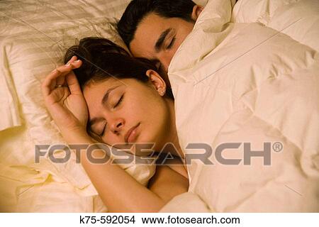 Couple, hispanic, age 20's and 30? s, sleeping, bed View Large Photo Image Picture - Couple, hispanic, age 20's and 30? s, sleeping, bed. Fotosearch