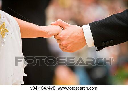 Couple holding hands at a dancing competition, Germany, Europe View Large Photo Image Stock Photo - Couple holding hands at a dancing competition, Germany, Europe. Fotosearch