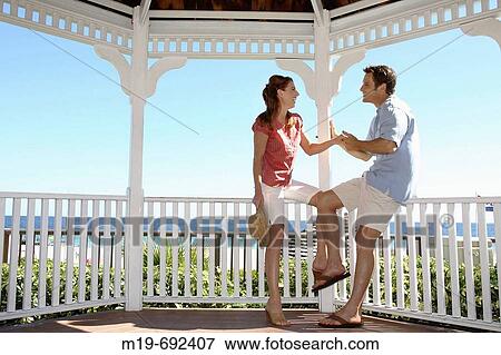 Couple holding hands in a Gazebo View Large Photo Image Stock Photo - Couple holding hands in a Gazebo. Fotosearch