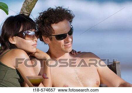 couple holidaying and relaxing View Large Photo Image Stock Photo - couple holidaying and relaxing. Fotosearch