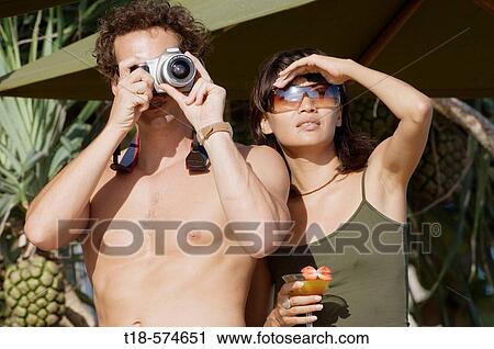 couple holidaying and taking snapshot View Large Photo Image Stock Image - couple holidaying and taking snapshot. Fotosearch