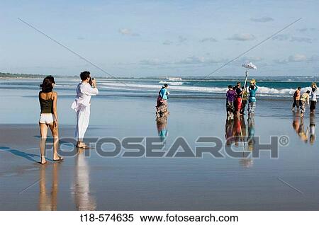 couple holidaying and taking snapshot on beach View Large Photo Image Stock Photography - couple holidaying and taking snapshot on beach. Fotosearch