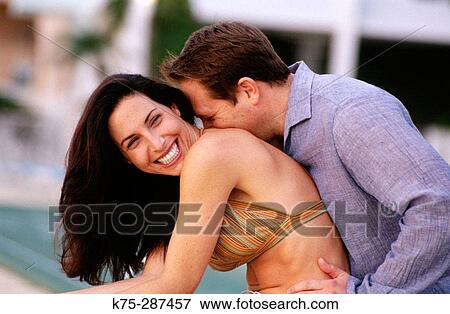 couple hugging and being playful View Large Photo Image Stock Photo - couple hugging and being playful. Fotosearch