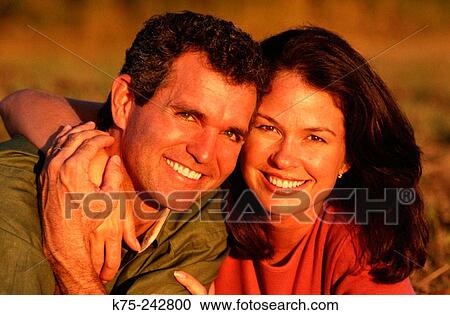 couple hugging and smiling View Large Photo Image Stock Image - couple hugging and smiling. Fotosearch