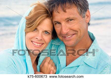 Couple hugging at beach View Large Photo Image Stock Image - Couple hugging at beach. Fotosearch