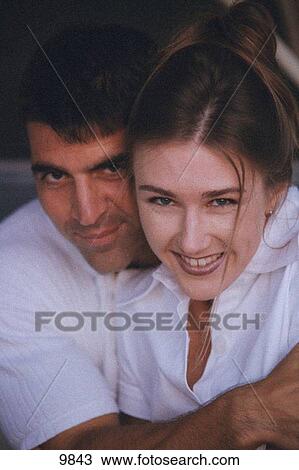 Stock Image - Couple hugging. Fotosearch