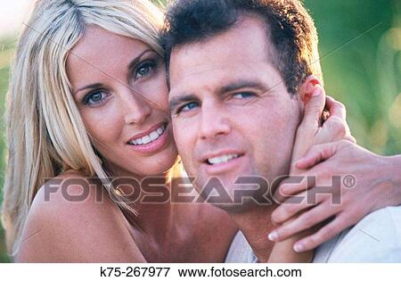 Stock Photo - Couple hugging. Fotosearch