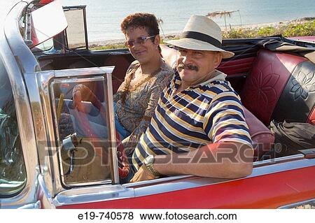 Couple in 1950 Chevrolet convertible, Cuba View Large Photo Image Stock Photo - Couple in 1950 Chevrolet convertible, Cuba. Fotosearch