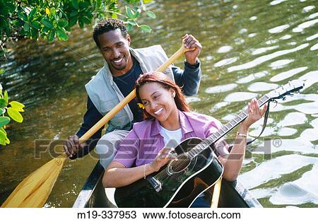 couple in a canoe View Large Photo Image Stock Image - couple in a canoe. Fotosearch