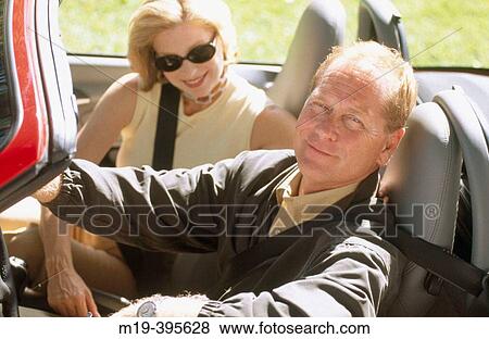 couple in a convertible View Large Photo Image Stock Photo - couple in a convertible. Fotosearch