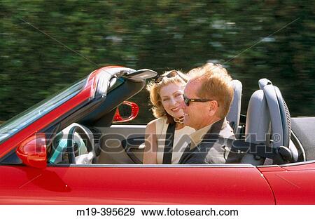 couple in a convertible View Large Photo Image Stock Photo - couple in a convertible. Fotosearch