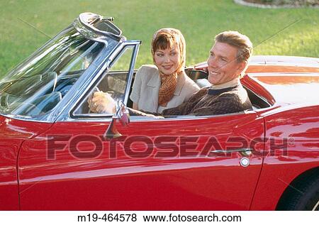 couple in a convertible View Large Photo Image Stock Photo - couple in a convertible. Fotosearch