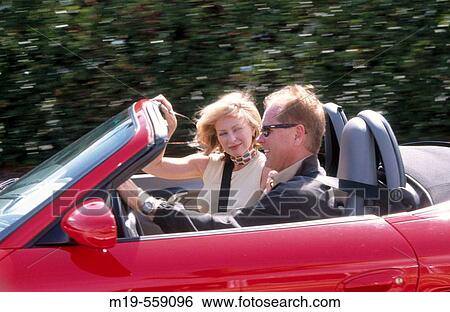 couple in a convertible View Large Photo Image Stock Photograph - couple in a convertible. Fotosearch