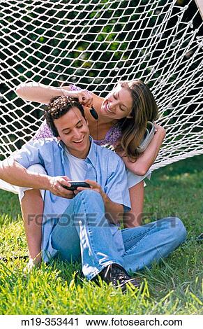 couple in a hammock View Large Photo Image Stock Image - couple in a hammock. Fotosearch