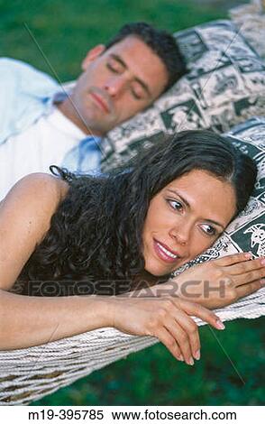 Stock Photography - couple in a hammock. Fotosearch