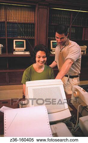 Couple in a library View Large Photo Image Stock Photography - Couple in a library. Fotosearch