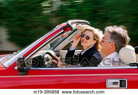 couple in a red convertible View Large Photo Image Stock Photo - couple in a red convertible. Fotosearch