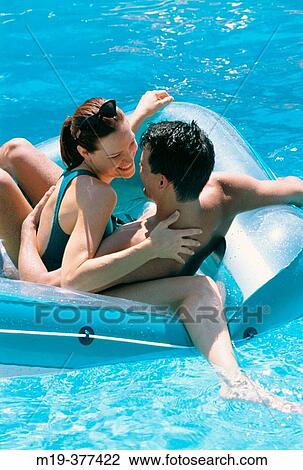 couple in a swiming pool View Large Photo Image Stock Image - couple in a swiming pool. Fotosearch