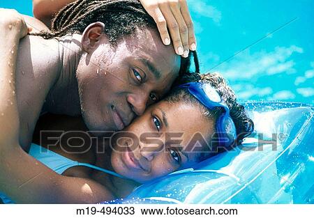 couple in a swiming pool View Large Photo Image Stock Image - couple in a swiming pool. Fotosearch